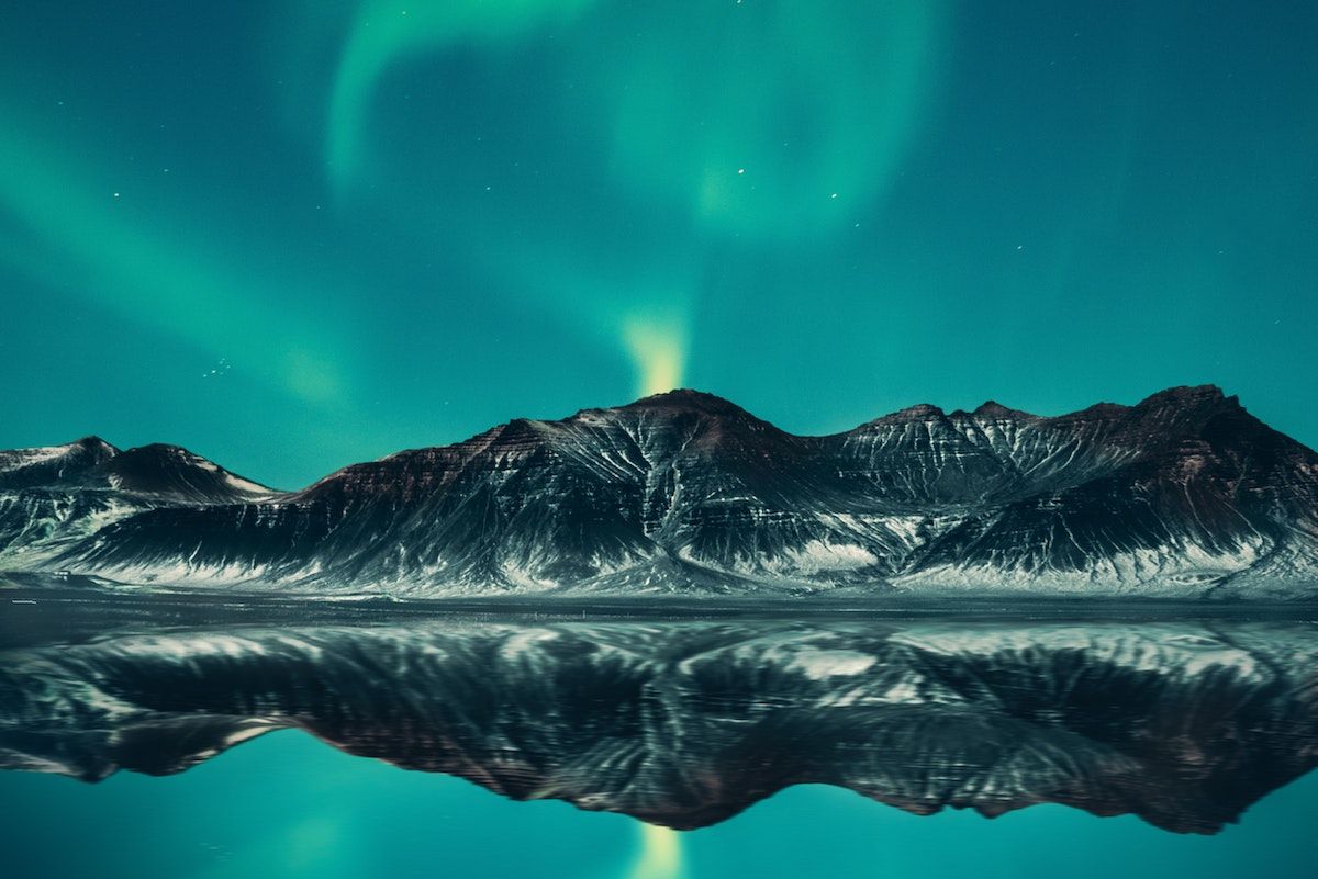 Aurora borealis over a mountain in Iceland