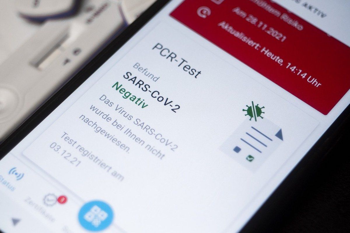 Smartphone displays Covid vaccine certificate for travel