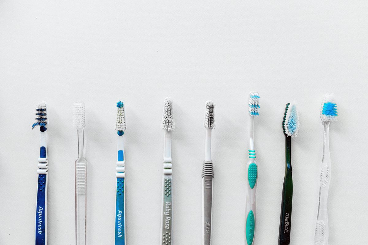 A row of plastic toothbrushes