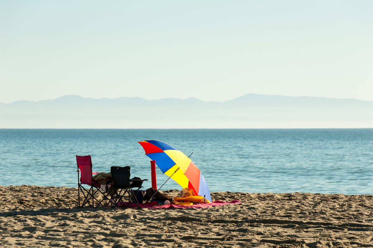 Beach parasol travelling by plane