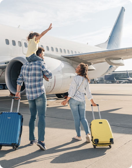 Family in front of plane at airport