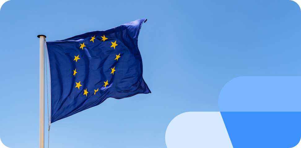 The EU flag flies in front of a clear sky representing strong rights in the EU for passengers